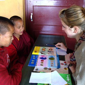 Volunteer Teaching Buddhist Monks