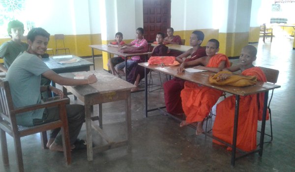 volunteer teaching buddhist monk in srilanka
